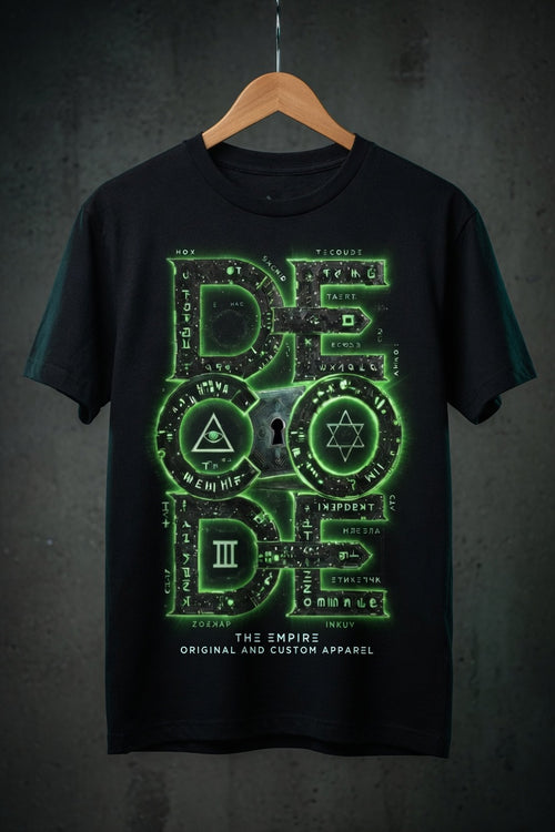 Black t-shirt with green geometric design on a hanger against a dark background